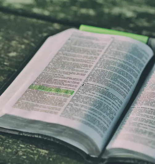 bible on wood table with verses highlighted at Lakeland Baptist Church in Iron River, Michigan